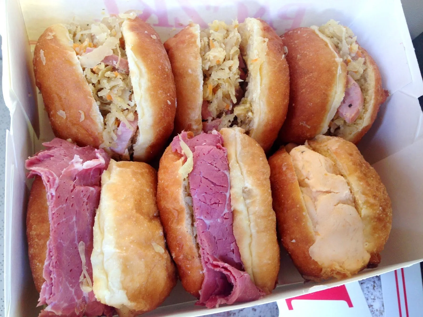Box of deli sandwiches on rye