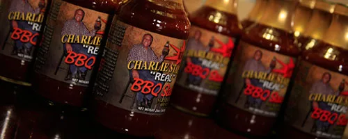 Bottles of Charlie Staples bar-b-que sauce