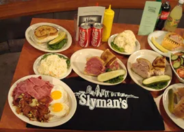 Table of Slyman's breakfast and corned beef plates